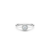 De Beers Aura Round Brilliant Diamond Ring-De Beers Aura Round Brilliant Diamond Ring in platinum. The ~0.20 carat round brilliant solitaire is surrounded by a halo of micropavé diamonds totalling ~0.10 carats.