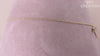 14 karat yellow gold diamond dragonfly necklace, totaling 0.08 carat weight. The length of the necklace measures 18 inches.