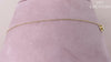 14 karat yellow gold diamond butterfly necklace, totaling 0.06 carat weight. The length of the necklace measures 18 inches.