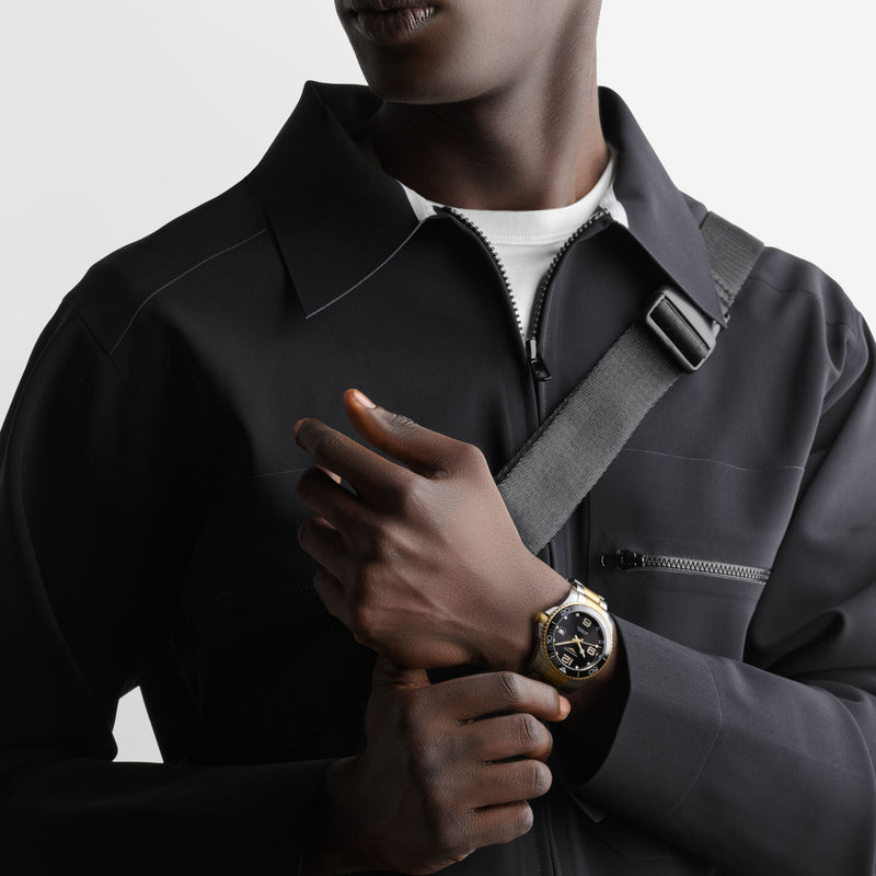 Longines HydroConquest 41mm-Longines HydroConquest - L3.781.3.56.7 - Longines HydroConquest in a 41mm stainless steel/yellow pvd coating/black ceramic case with black dial on two tone bracelet, featuring a date display and automatic movement with up to 72 hours of power reserve.