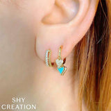 Shy Creation Diamond Huggie Earrings 0.19 CT-Shy Creation Mini Hoop Earrings in 14 karat yellow gold with diamonds totaling 0.19 carats.